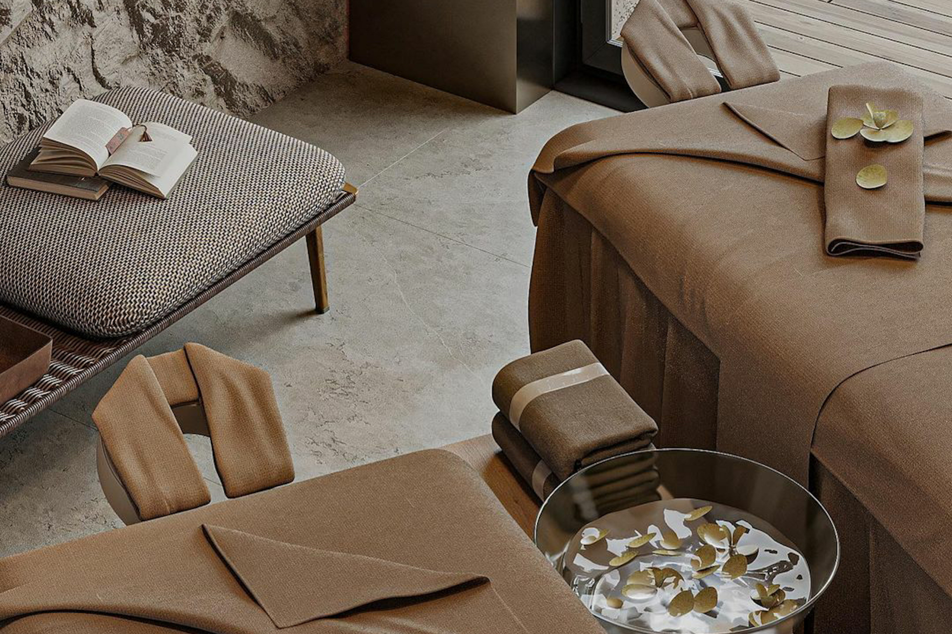 spa massage table setup with linens, bolsters, and accessories arranged in a professional treatment room