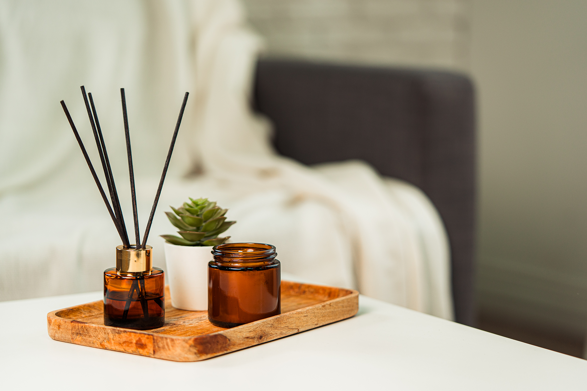 massage room decor with essential oil diffuser and tray creating spa ambiance in a relaxing massage room setup