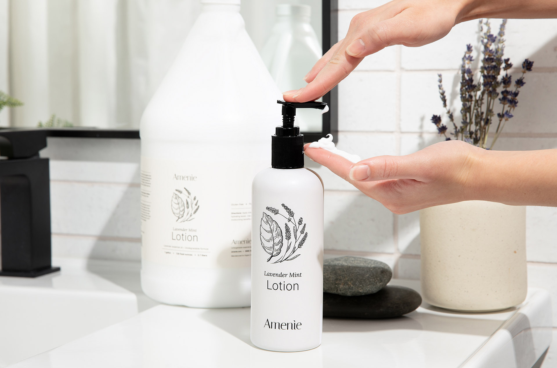 Refillable Amenie Lavender Mint lotion bottle with gallon refill—sustainable, bulk toiletry option for eco-conscious Airbnb bathrooms.