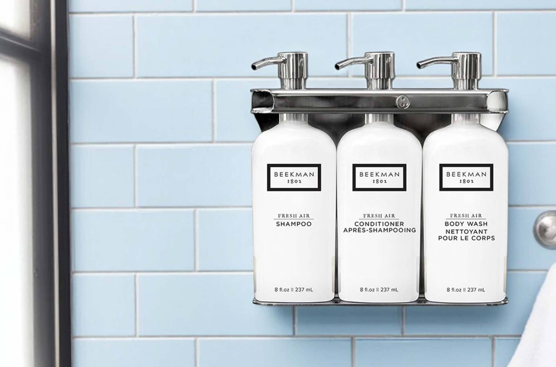 Wall-mounted refillable shower dispensers for vacation rental cleaning and restocking