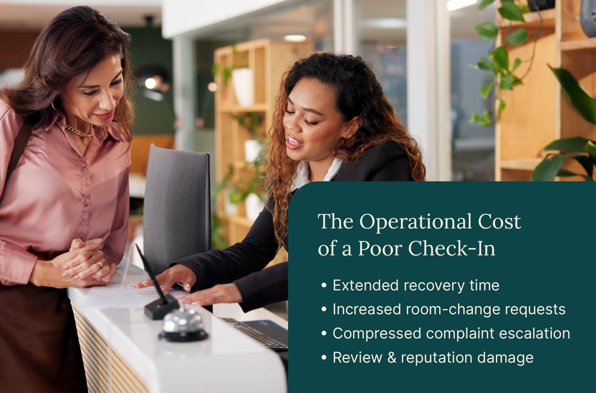 Hotel guest reviewing check-in details with a front desk agent, illustrating how the hotel check-in experience affects guest satisfaction and complaints