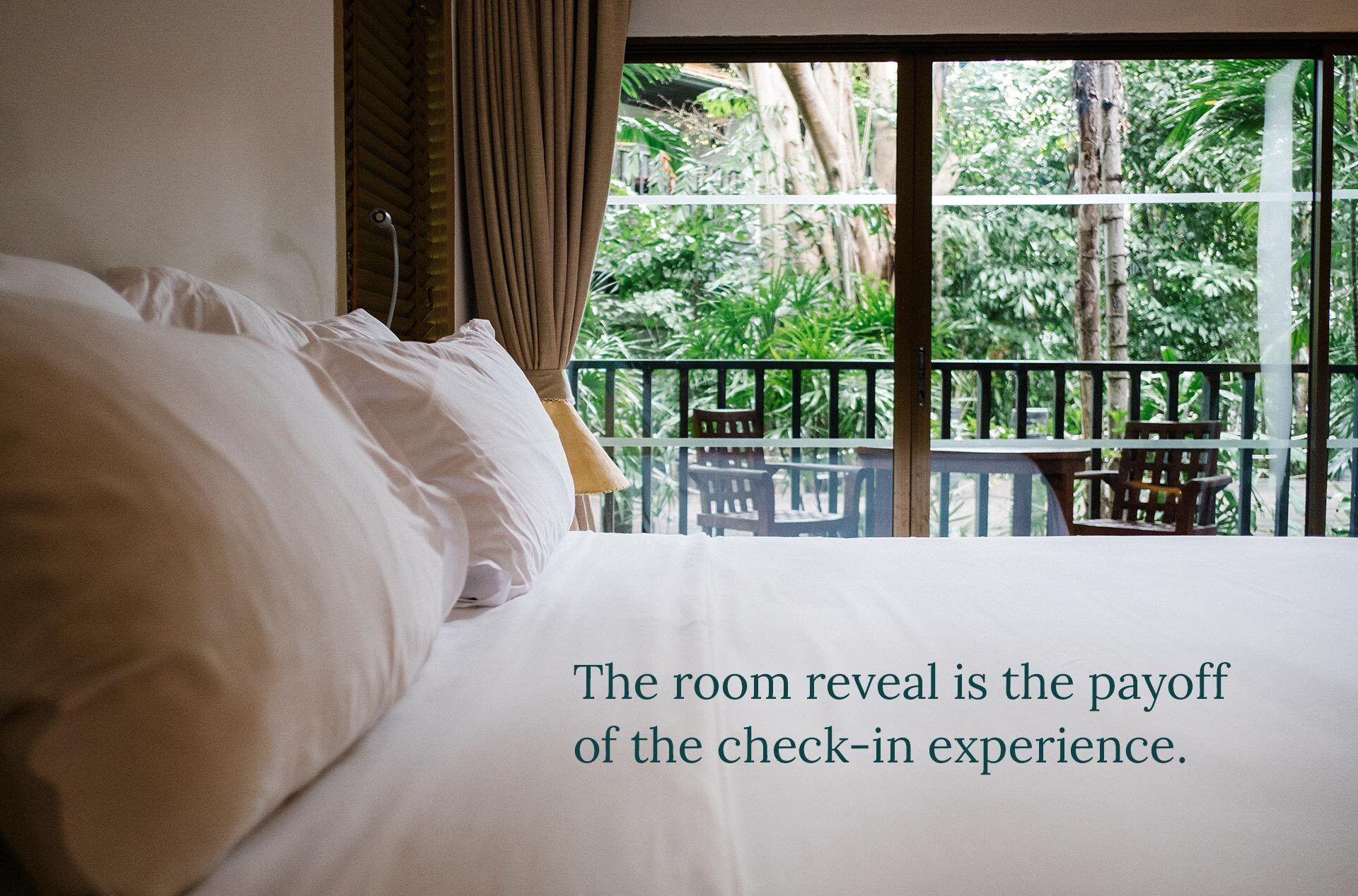 Prepared boutique hotel guest room with a neatly made bed, showing how room-ready standards support guest satisfaction after check-in